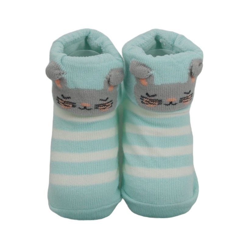 Close-up of baby girl's blue striped socks with cute bunny face design.