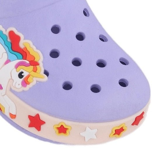 Close-up of a Purple kid's clog with a unicorn motif and colorful stars along the rim