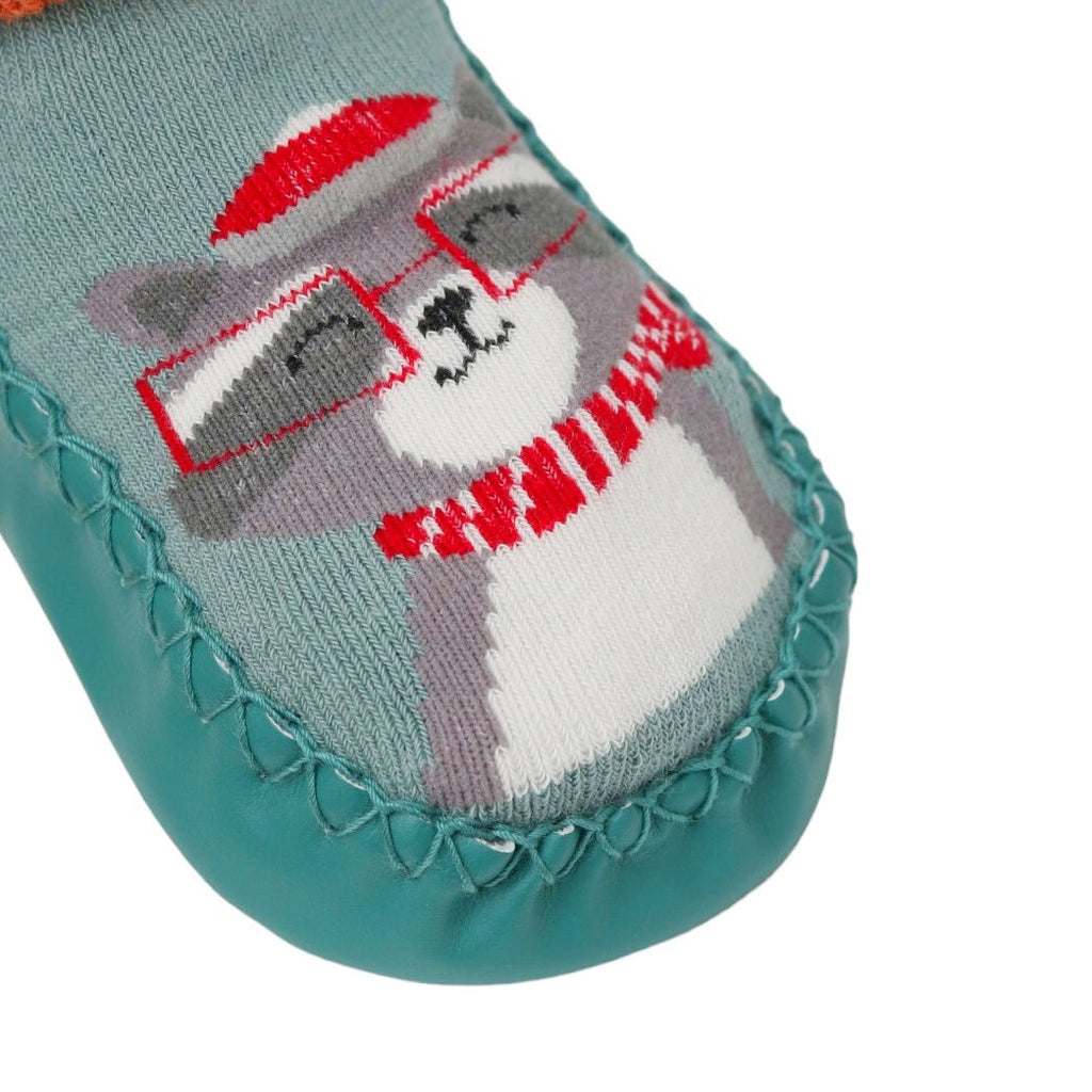 Close-up of the kitty face on Yellow Bee's cotton and leather crew length socks for baby boys.