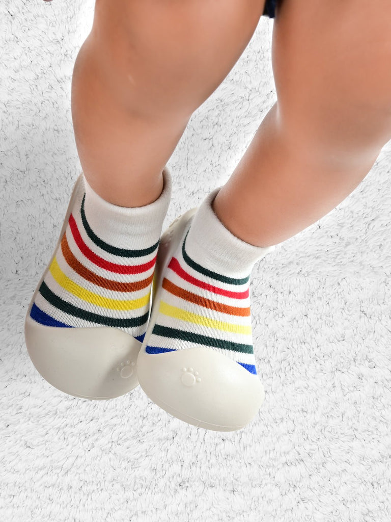 Pair of Rainbow Striped Shoe Socks by Yellow Bee, perfect for playful toddlers on the move
