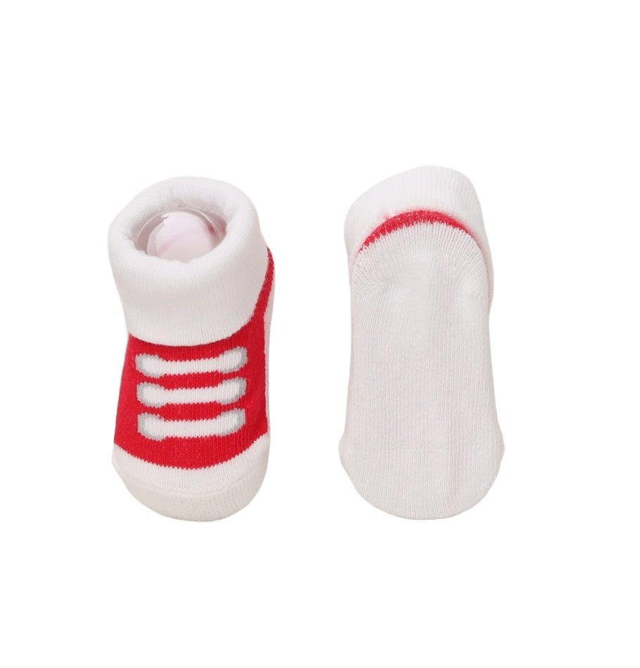 Bottom and side views of Yellow Bee's red and white striped baby socks.
