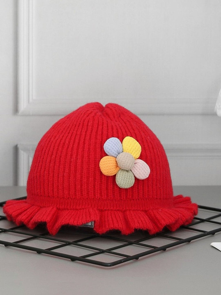 Girl's Red Knitted Hat with Multicolored Flower Accent on Display