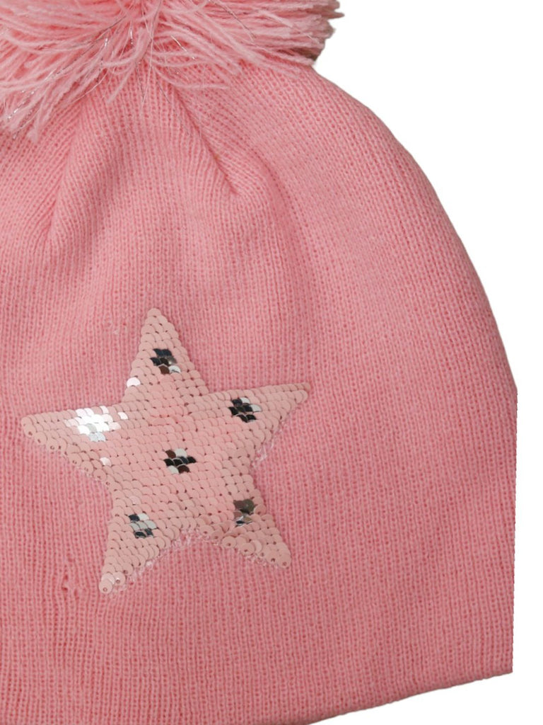 Close-up of the pink knitted hat displaying the star made of reversible sequins and the pom-pom detail.