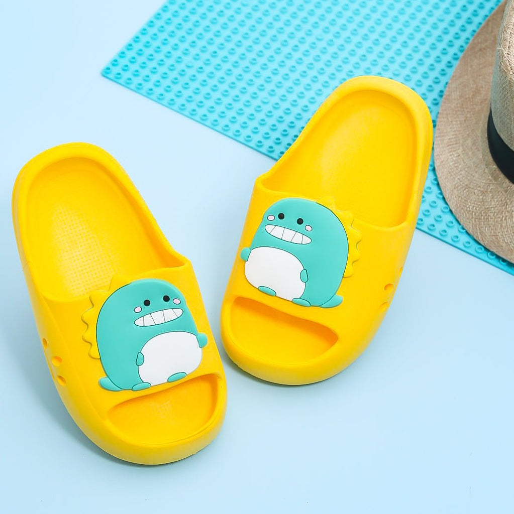 Bright yellow children's slides with a teal dinosaur applique byYELLOW.160 Yellow Bee