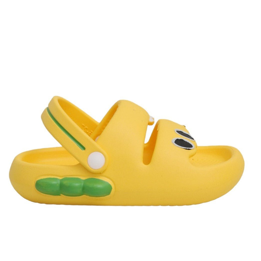 Side view of yellow dino sandals showing the profile of the green scales and overall design.