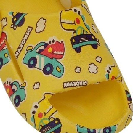 Close-up of children's yellow sandals featuring a dino driving car print