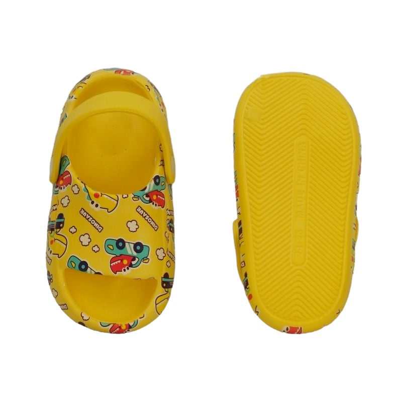 "Top and bottom view of yellow sandals with dinosaur and car print for children
