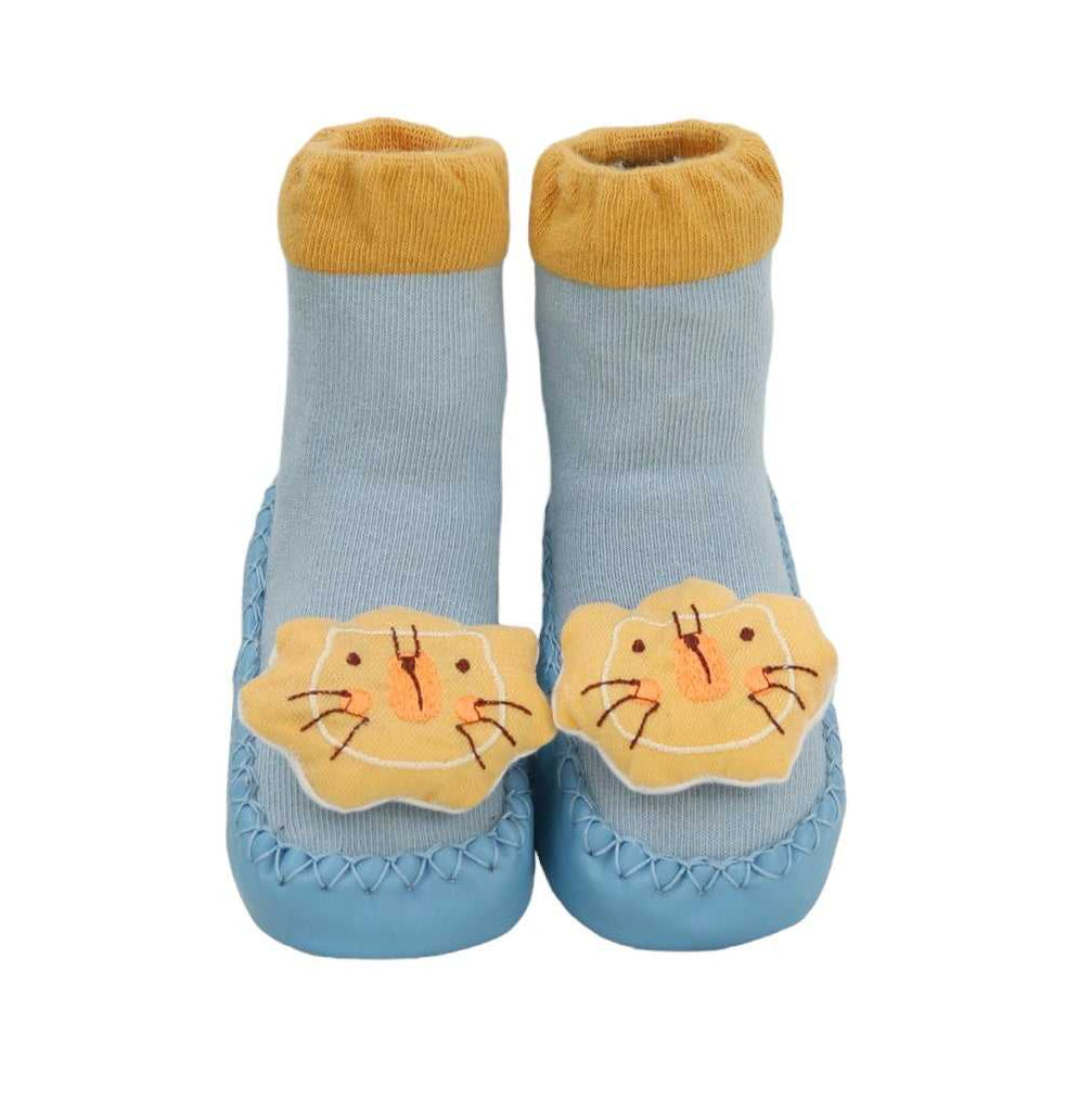 Front view of baby boy's blue leather socks with 3-D lion applique on the top.