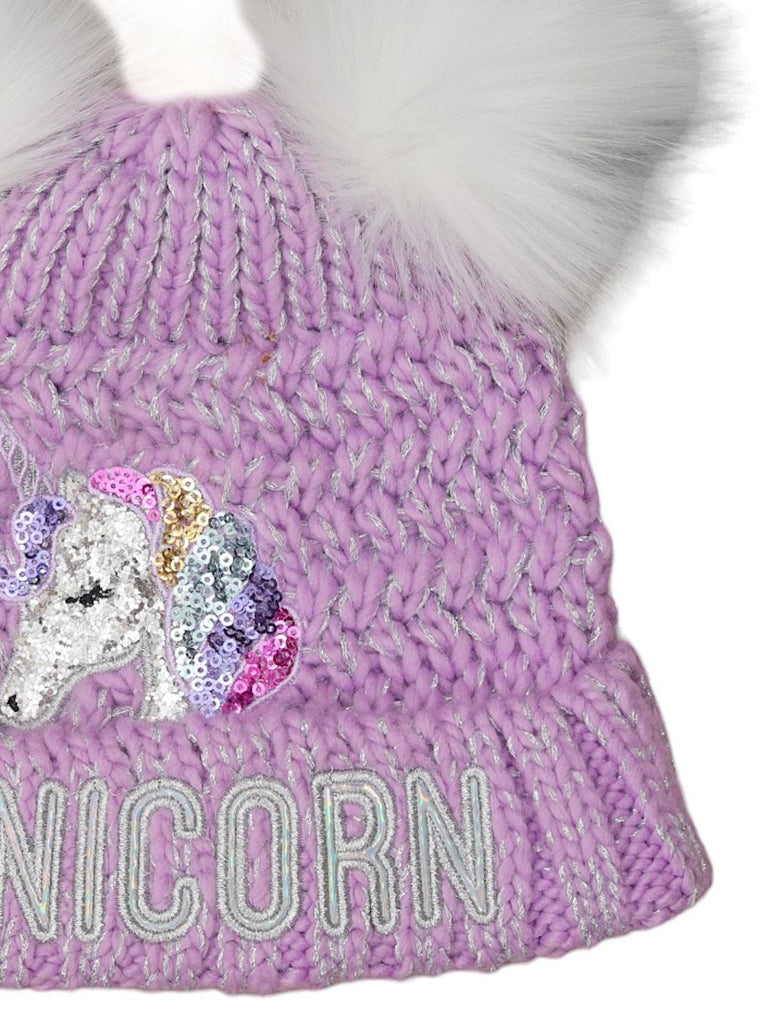 Close-up side view of the sequins unicorn embellishment on the girl's lavender winter hat.