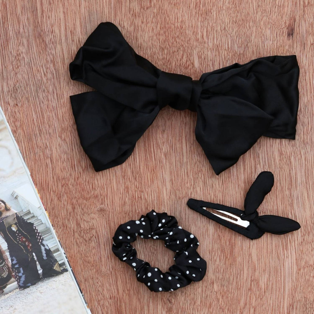 Yellow Bee's black hair accessory set featuring two clips and a scrunchie for girls.