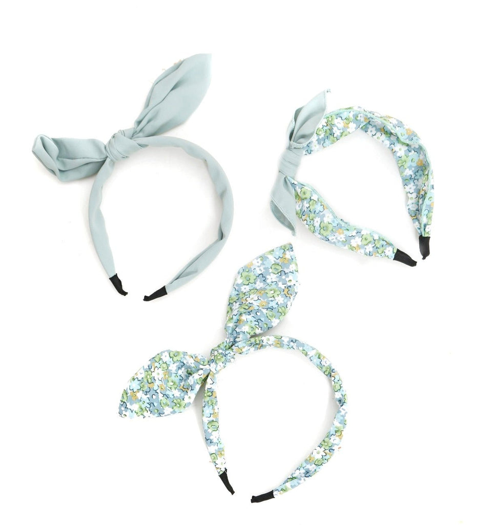 Top and side views of Yellow Bee's blue hair bands for girls, showcasing floral and solid patterns.