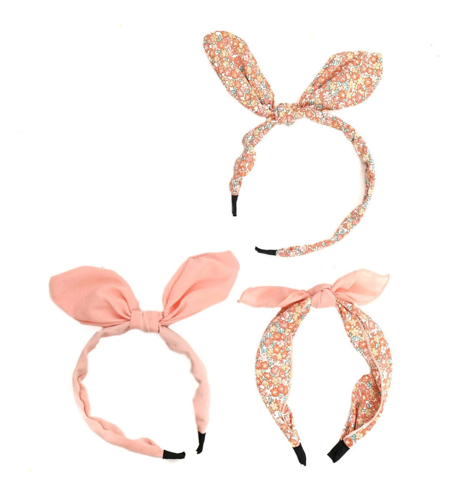 Yellow Bee's peach hair bands for girls displayed in a set of floral and solid patterns.