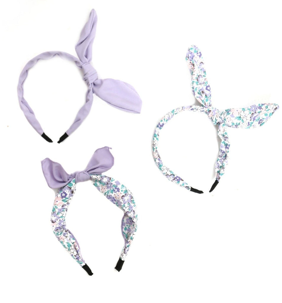Yellow Bee's purple hair bands displayed from various angles, showcasing the versatile styles.
