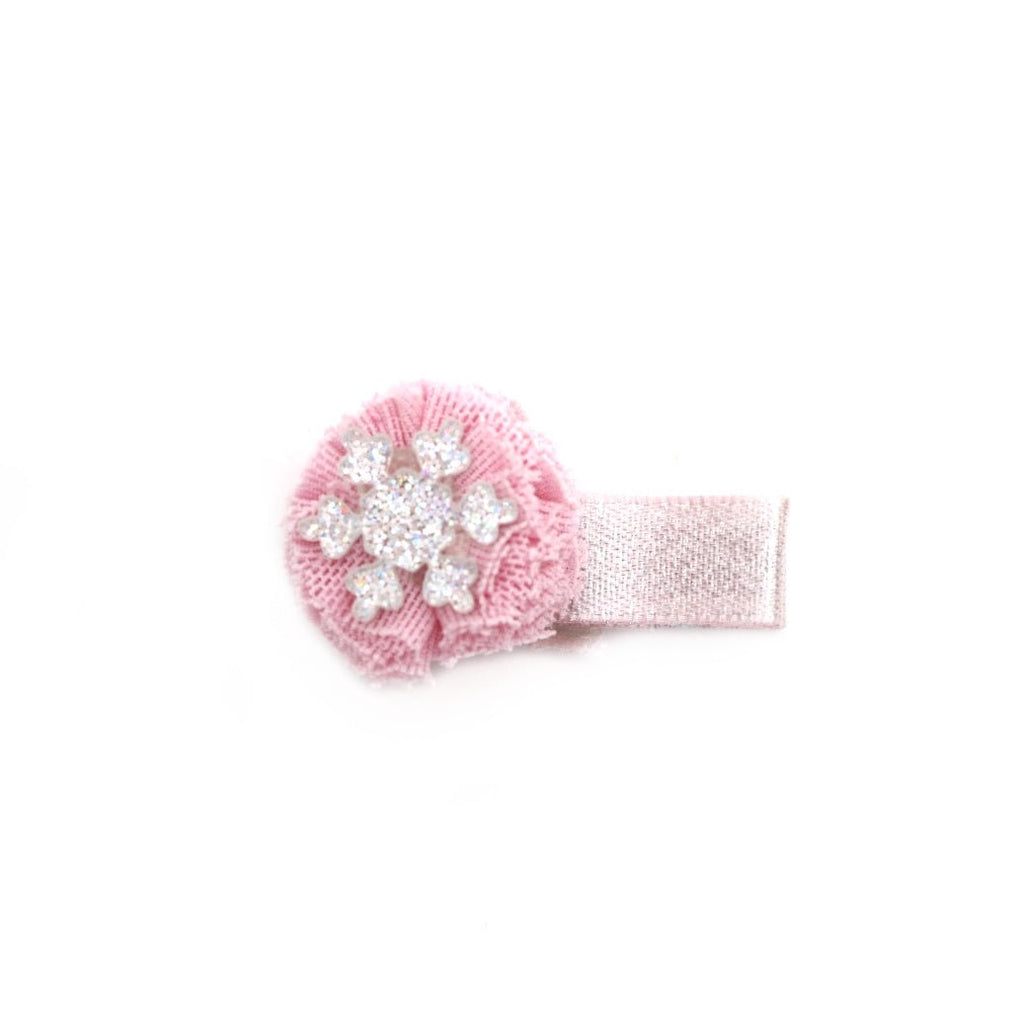 Delicate pink flower hair clip with a snowflake center, a charming piece by Yellow Bee.