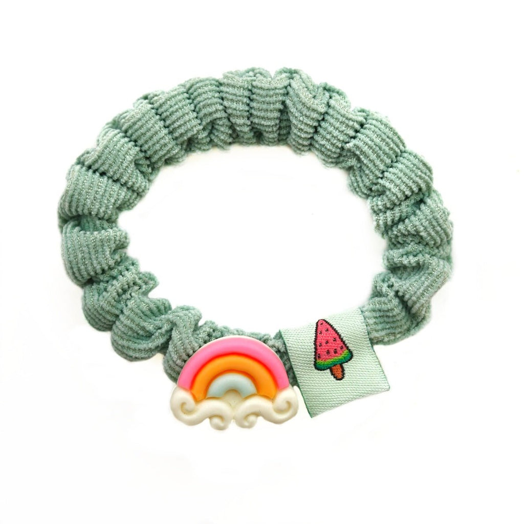 Green rubber band with a rainbow charm, a colorful hair accessory by Yellow Bee.