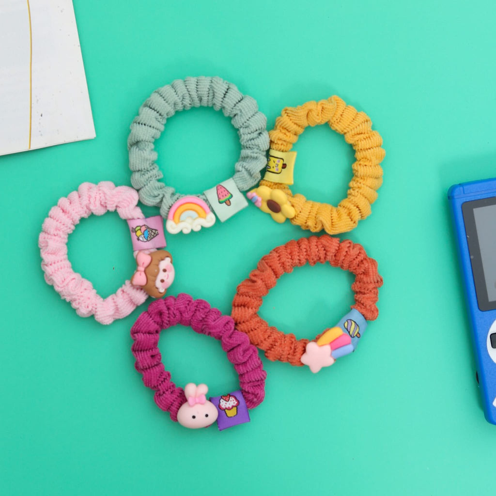 A vibrant set of embellished rubber bands for girls by Yellow Bee in assorted colors.