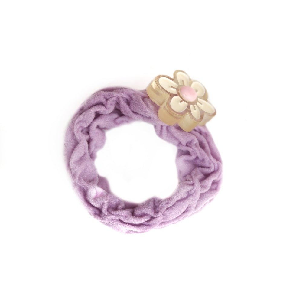 Purple rubber band adorned with a charming flower for girls, by Yellow Bee.