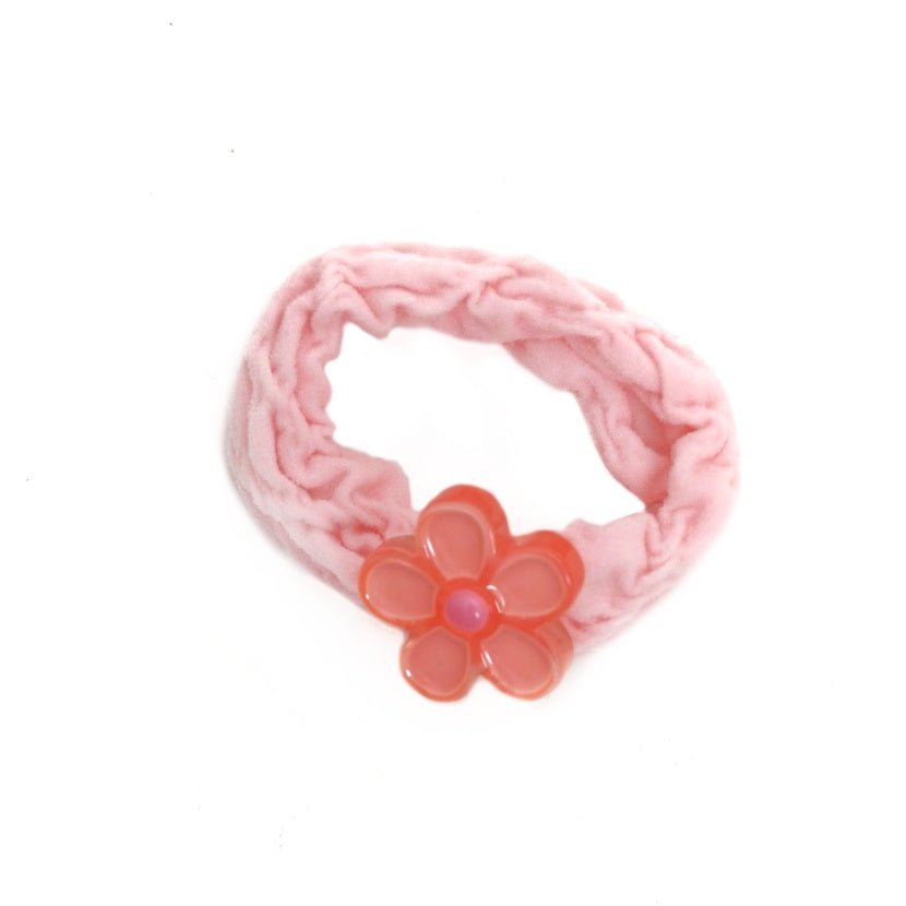 Soft pink rubber band with a delicate flower embellishment for girls by Yellow Bee.