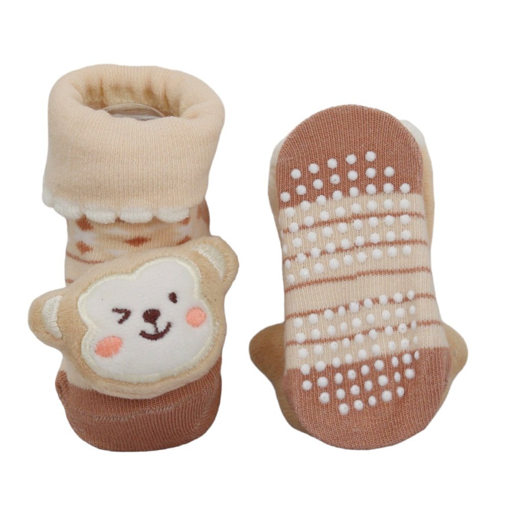 Baby socks with a monkey design and anti-slip grips for safe play.