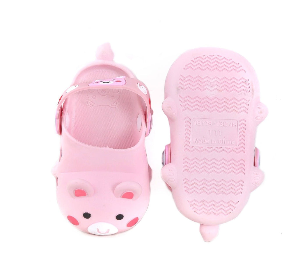 Top and bottom view of the soft pink bear-patterned clogs, showing off the safe tread.