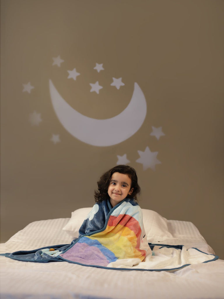 Happy Child Sitting in Bed with Yellow Bee Bunny Blanke