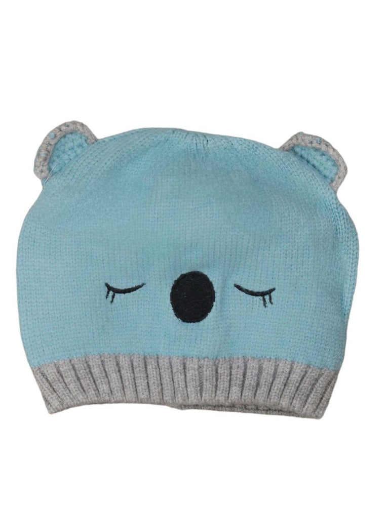 Front view of boys' white knitted bear beanie with face detail