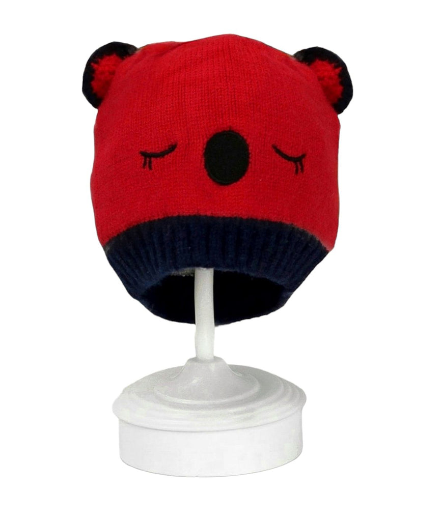 Red and navy knitted beanie with cute teddy ears for boys showcased on a white stand.