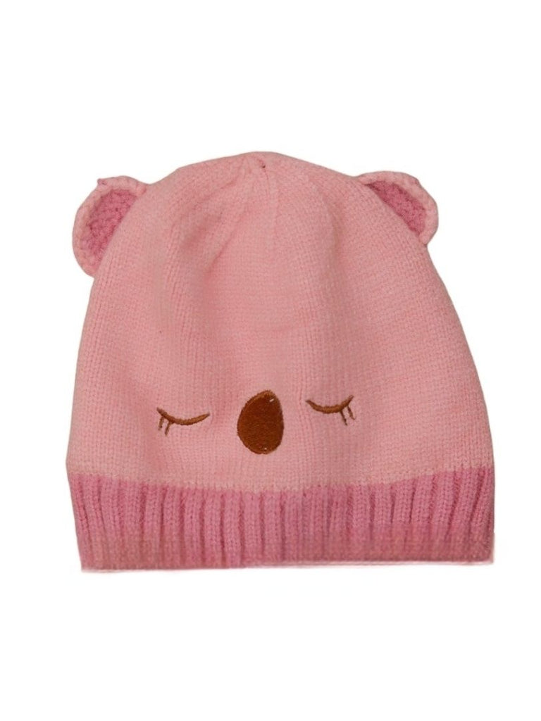 Light pink knitted beanie with teddy ears for girls aged 6-18 months.