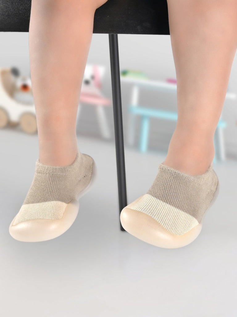 Child sitting with BEIGE Solid Shoe Socks by Yellow Bee