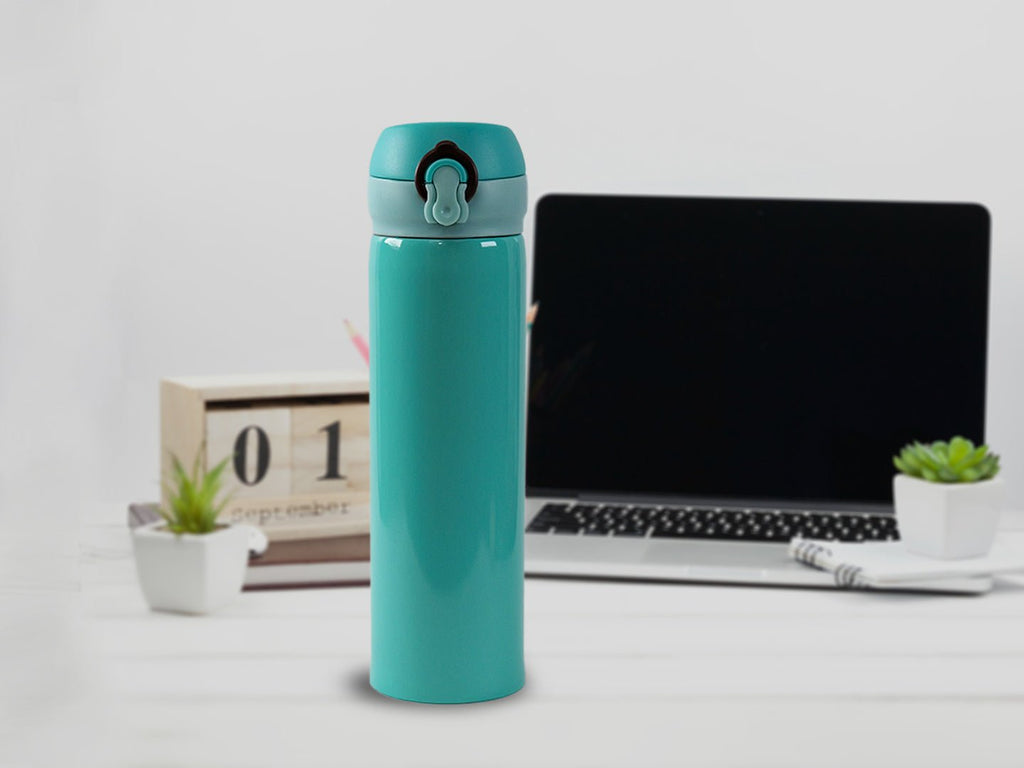 Aqua-colored Yellow Bee Stainless Steel Thermos Flask 500ML on a desk.