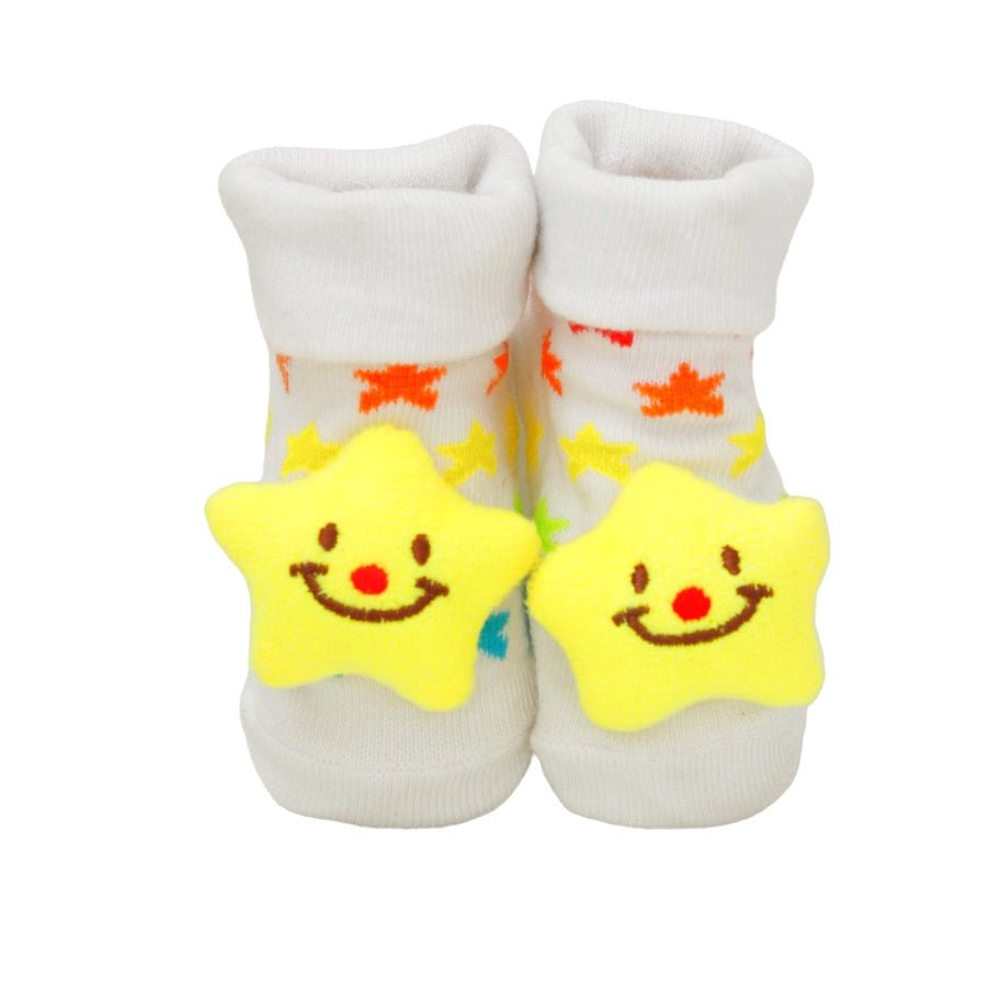 Pair of baby boy's socks with smiling star appliques on white background