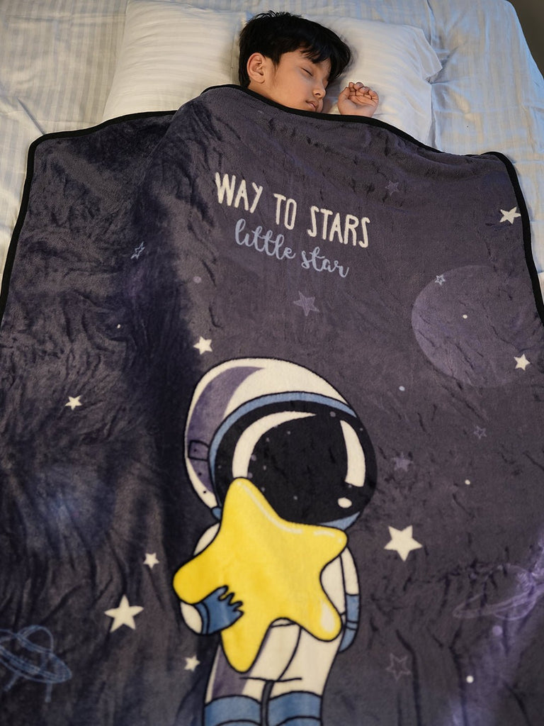 Boy Enveloped in Astronaut Blanket - Snug in Starry Night