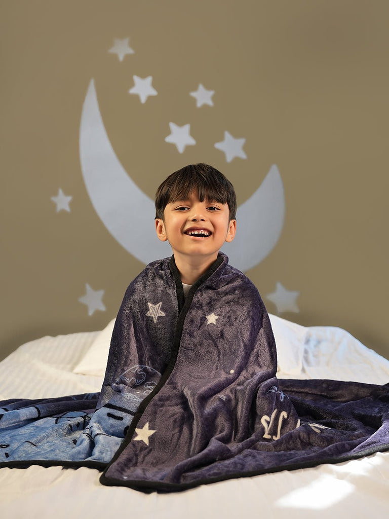 Smiling Boy Wrapped in Astronaut Blanket - Joyful Space Adventures