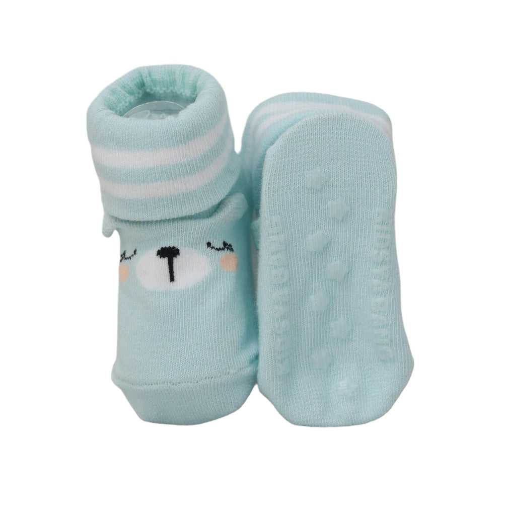 Anti-slip baby socks with a blue rocket pattern on sole