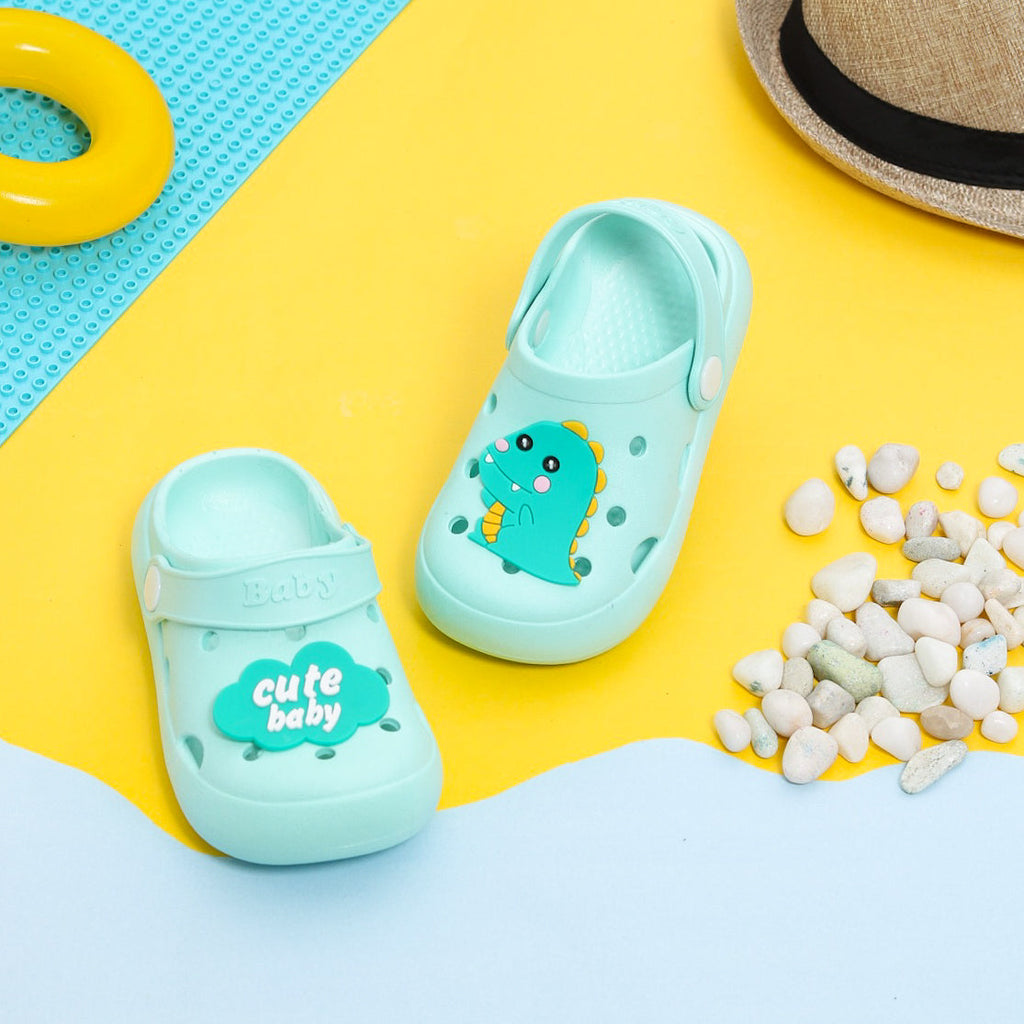Adorable Dino Motif Clogs displayed with playful background, perfect for kids.