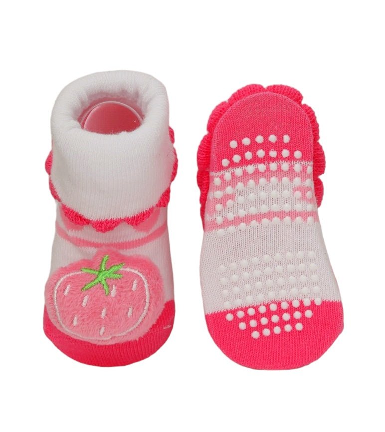 Anti-slip sole detail of Yellow Bee's strawberry socks for baby girls.