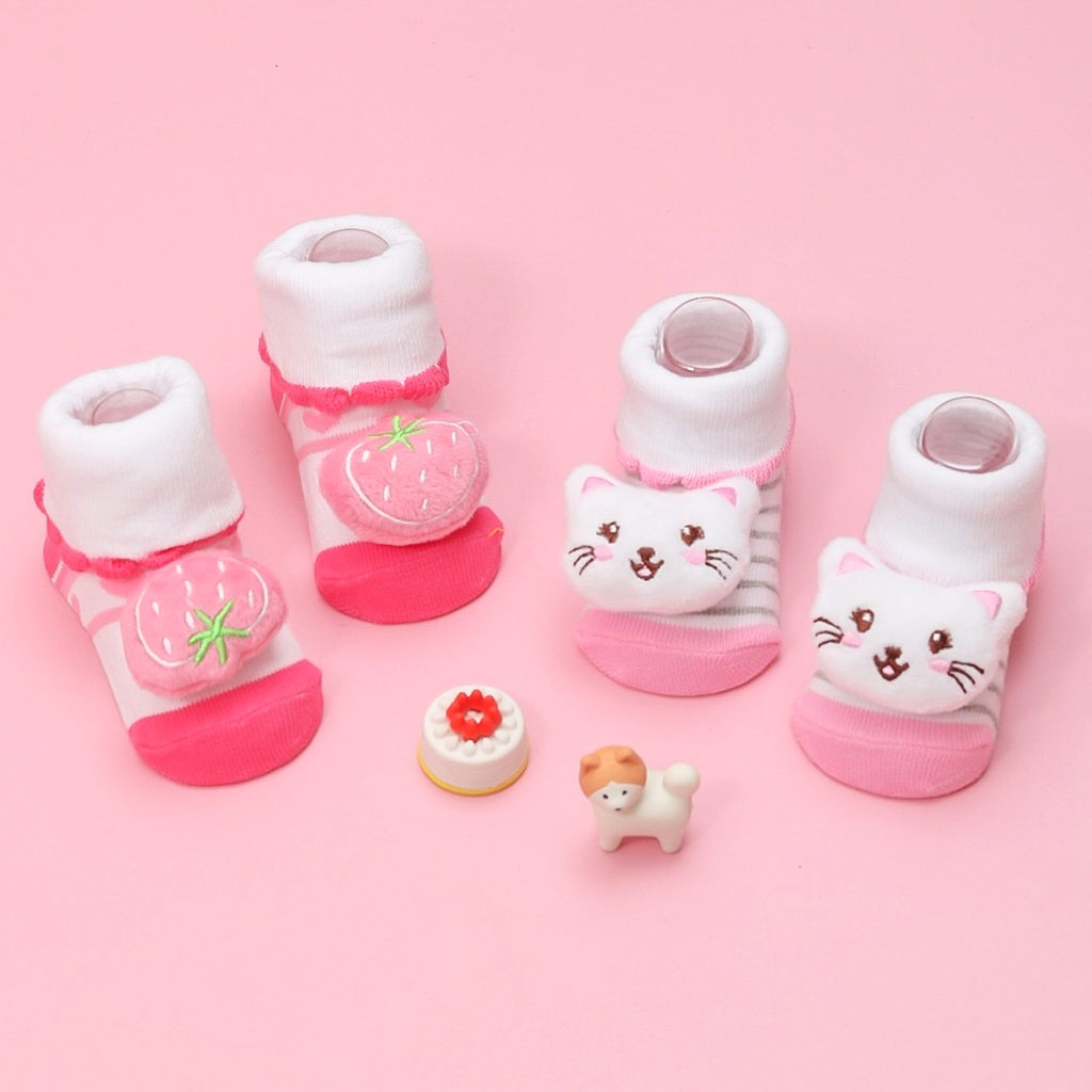 Assorted Yellow Bee baby girls' socks set with strawberry and cat designs on a pink background.
