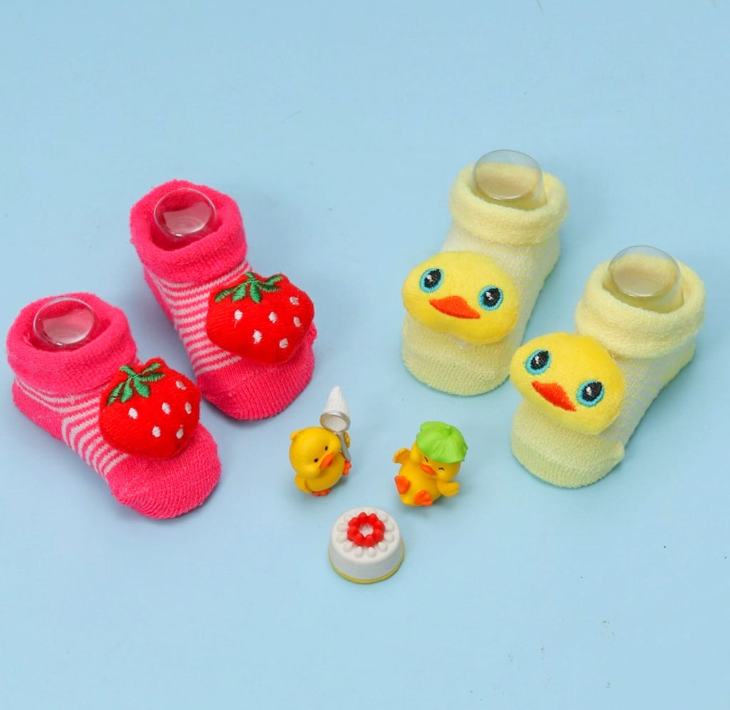 Colorful stuffed toy socks set with strawberry and duck designs for infants.