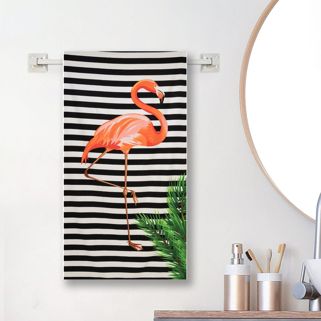 Yellow Bee's striped flamingo towel elegantly displayed in a home setting