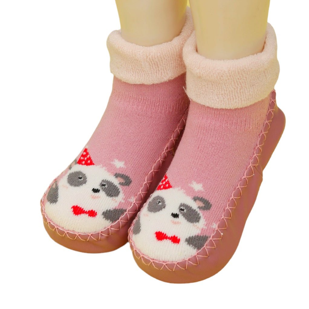 Adorable baby girl wearing pink panda print socks with leather outsoles and comfy cuffs