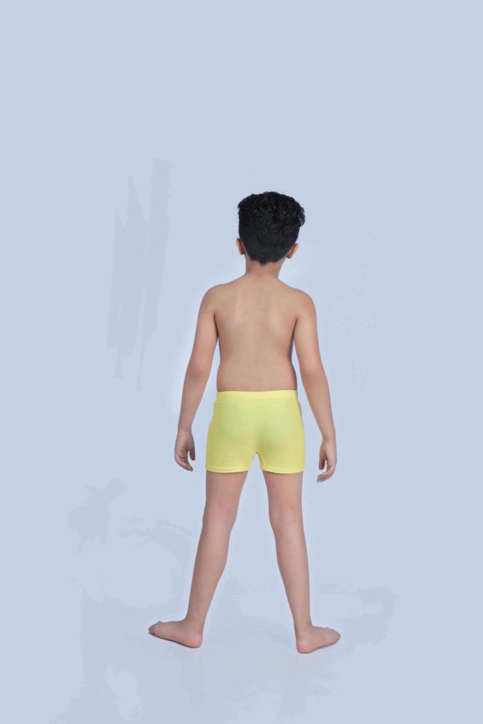 Back view of a young boy wearing yellow swim shorts, ready for a day at the beach with a comfortable and secure fit.