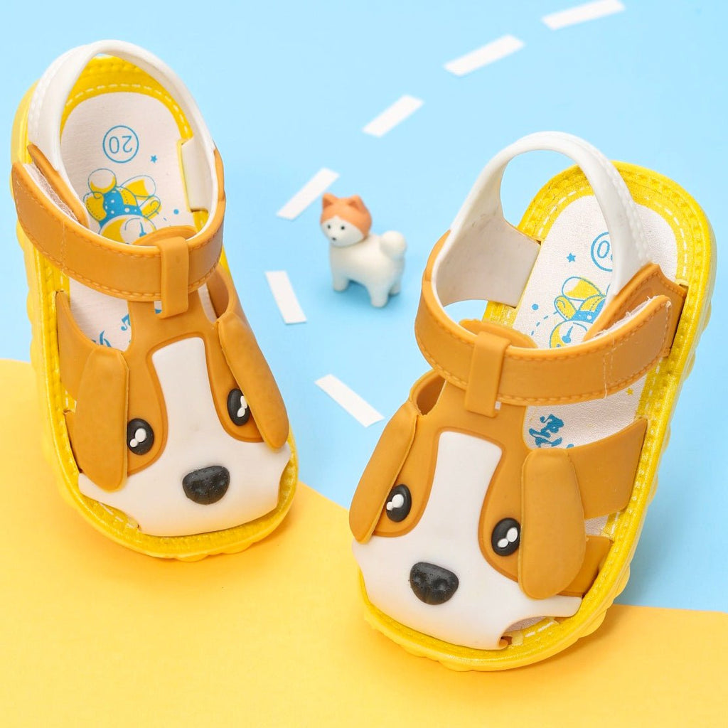 Cheerful brown sandals with puppy applique for toddlers, displaying a playful design and bright color contrast.