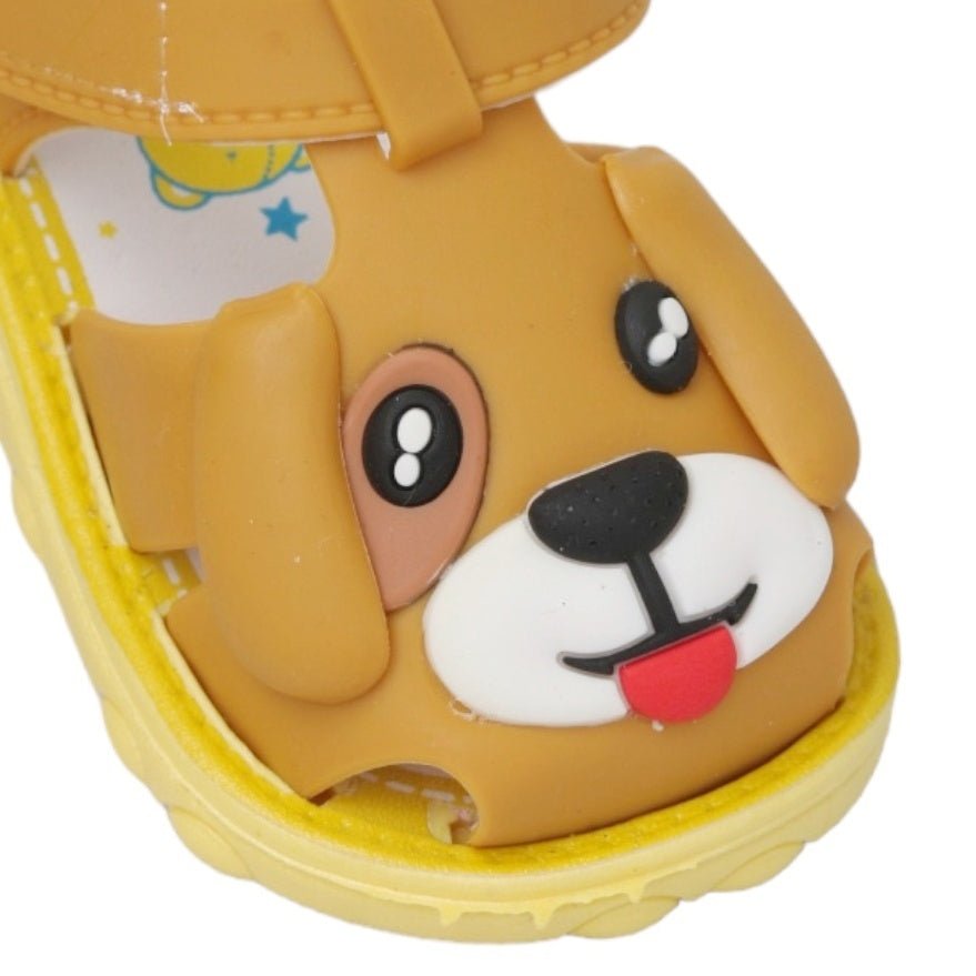 Close-up of the brown puppy face on the applique toddler sandals, showcasing the intricate details