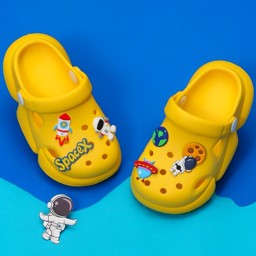 ellow space-themed clogs for kids with rocket and astronaut decorations