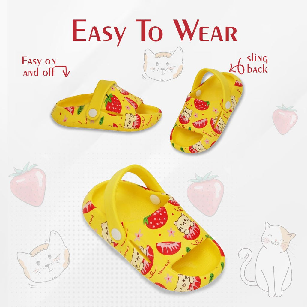 Pair of yellow strawberry and cat print sandals highlighting the easy slip-on design with a comfortable slingback.