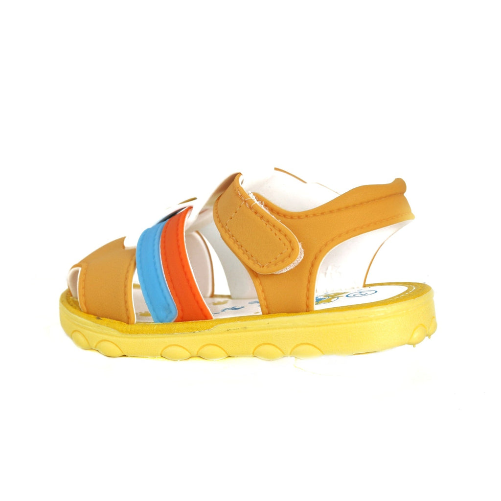 Side view of children's brown sandals with vibrant stripe details and secure velcro fastening.