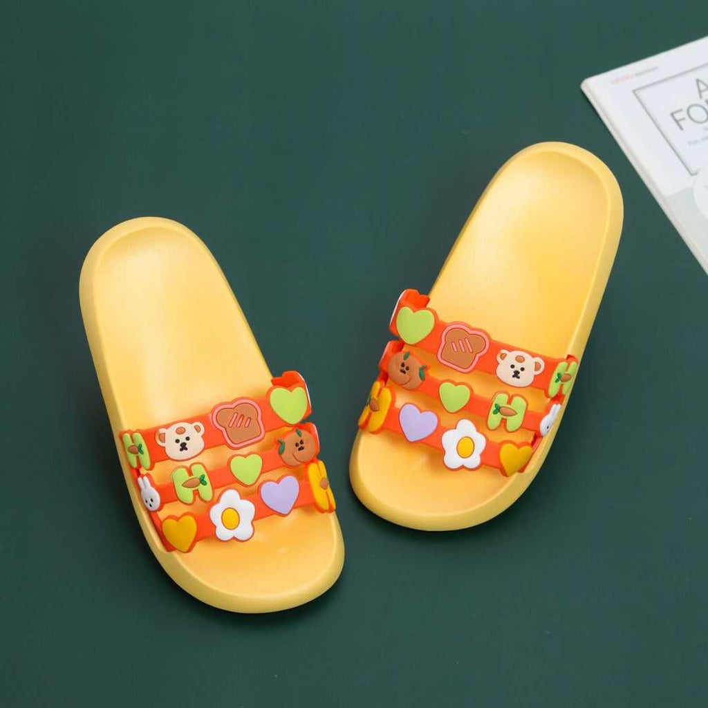 Pair of children's applique slides on a green background, illustrating the fun and colorful design elements
