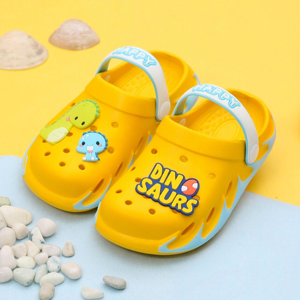 Vibrant yellow kids' clogs with a dinosaur theme, designed for comfort and fun.