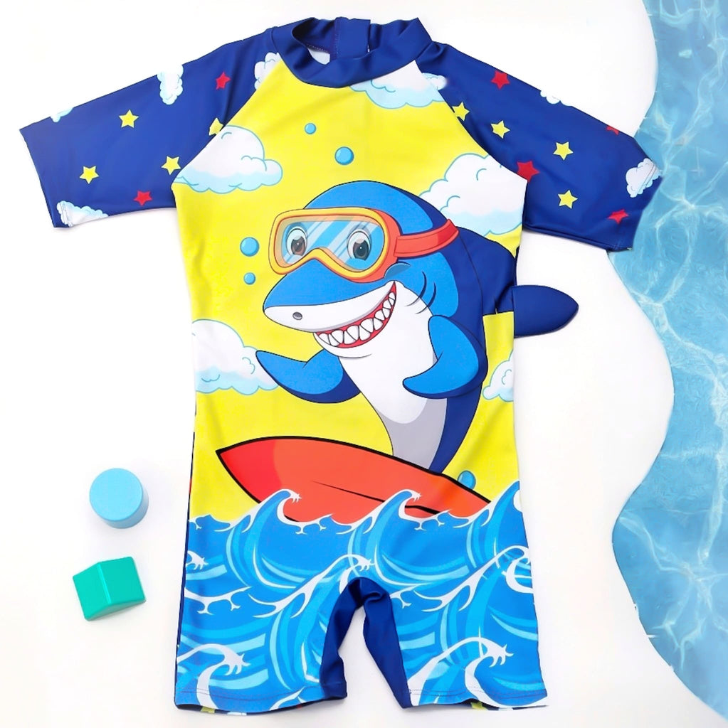 Boys' blue half sleeve swimsuit with a fun shark print and surfboard illustration