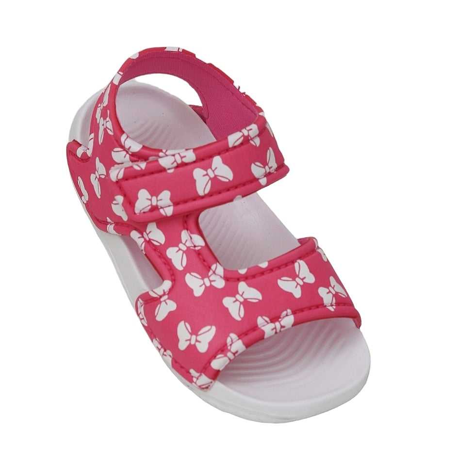 Angled view of kid's pink sandal with adorable bow print